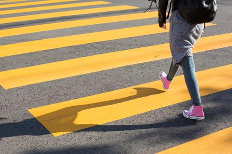 girl-crossing-street-on-a-yellow-crosswalk-picjumbo-com