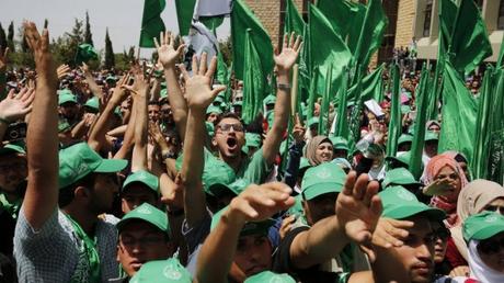 Palestinian students who support the Hamas movement take part in an election campaign rally for the student council at Birzeit University, near the West Bank city of Ramallah on April 26, 2016 (AFP/Abbas Momani)