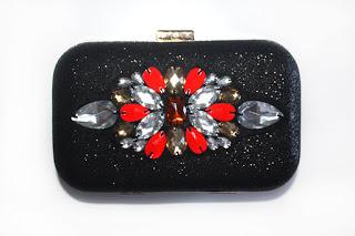 Bolso joya garabatea en negro brillante y tonos rojizos