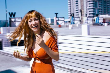 Cowboy boots + wavy wig street style