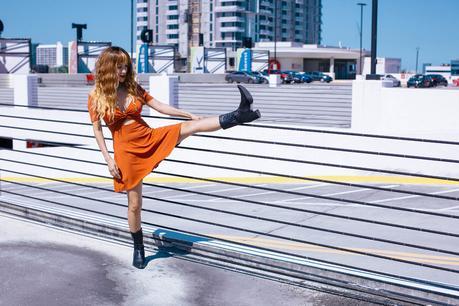 Cowboy boots + wavy wig street style