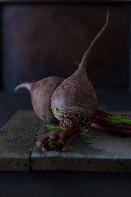 Photo by Yelena Strokin  •WHY I LOVE IT: Because it could be a painting. Yelena's work is thoughtful, simple and dramatically lit. The choice of background and angle is perfection. That ray of light coming in and hitting the side of the beets feels like a winter light. I love it all.: 