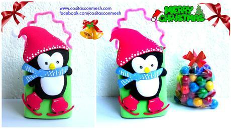 Bolsita de dulces de pingüino navideño reciclando cajas de leche