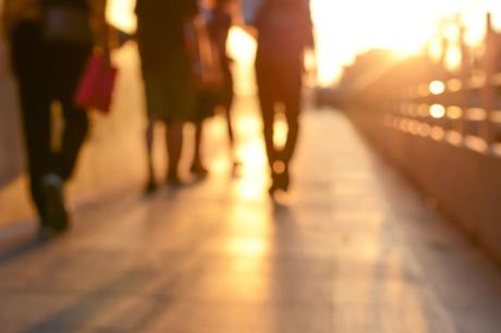 45616367 - blur silhouette of people walking on walkway in twilight