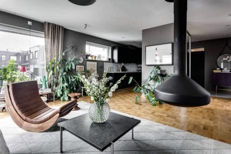 Tonalidades de gris en el salon chimenea colgada