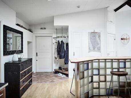 vigas en el techo salon chimenea ladrillo visto estufa de leña estilo nórdico decoración terrazas decoración áticos cenas en la terraza atico escandinavo 