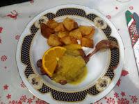 Confit de pato con salsa de naranja y patatas