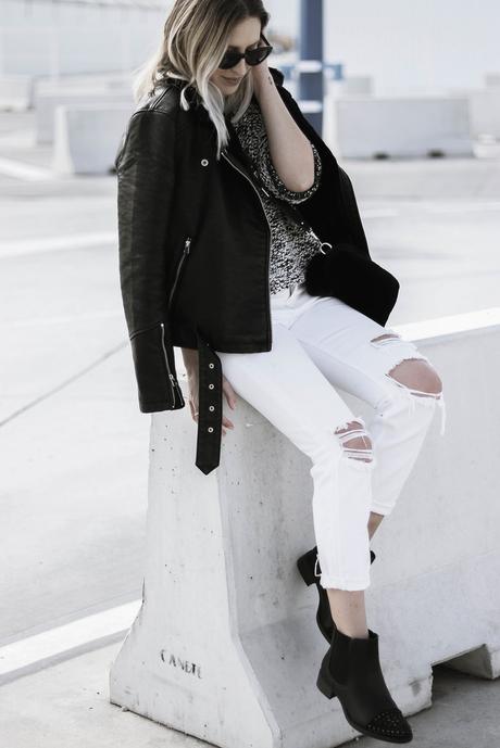 BLACK JACKET AND WHITE PANTS