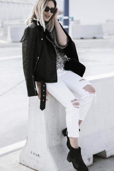 BLACK JACKET AND WHITE PANTS