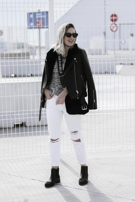 BLACK JACKET AND WHITE PANTS