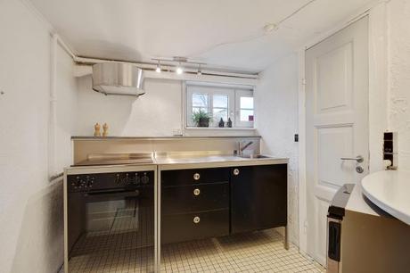 estilo escandinavo eames chair distribución abierta diseño interiores decoración sótano decoración nórdica comoda danesa casa danesa dos pisos casa con sótano 