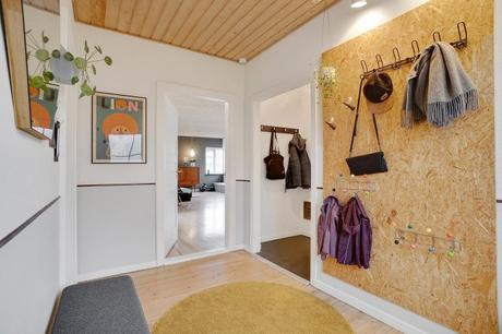 estilo escandinavo eames chair distribución abierta diseño interiores decoración sótano decoración nórdica comoda danesa casa danesa dos pisos casa con sótano 