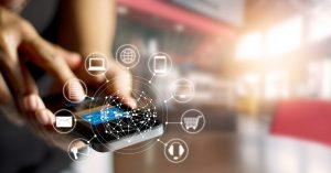 ¿Cómo potenciar tu negocio en Internet? Man using mobile payments online shopping and icon customer network connection on screen, m-banking and omni channel