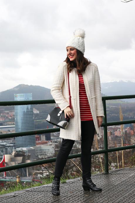 Outfit de invierno con abrigo blanco