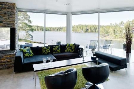 muebles de terraza muebles de jardín muebles de diseño isla en la cocina estilo nórdico estilo escandinavo espacios diáfanos diseño de interiores decoración en blanco y negro decoración de interiores cocina moderna cocina blanca cocina abierta al salón chimenea en el salón casa de lujo en suecia 