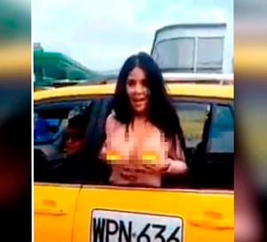 Vídeo Venezolana saca sus pechos por un taxi en Bogotá