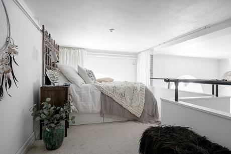 Frente de pizarra para la cocina y ladrillo visto.