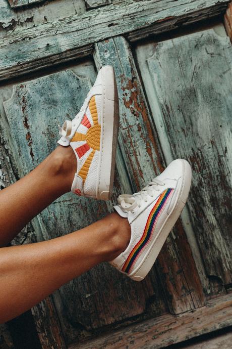 Sara of Collage Vintage wearing a long mustard dress and embroidered sneakers