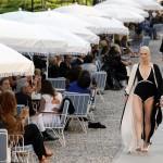 Models present creations by Lagerfeld as part of his 2011-2012 Cruise collection show for French fashion house Chanel at the Cap d'Antibes on the French Riviera