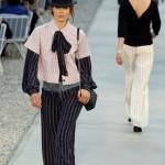 Models present creations for French fashion house Chanel at the Cap d'Antibes on the French Riviera