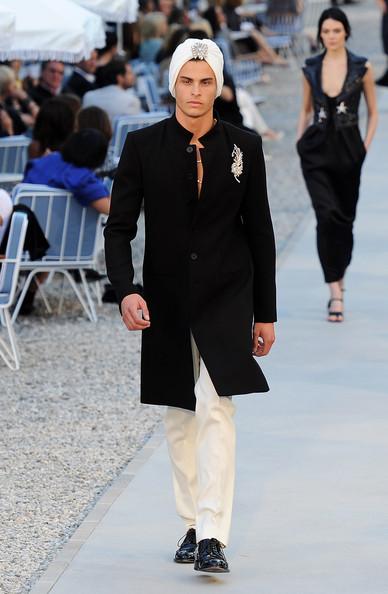 Baptiste Giabiconi walks the runway during the Chanel Collection Croisiere Show 2011-12 at the Hotel du Cap on May 9, 2011 in Cap d'Antibes, France.