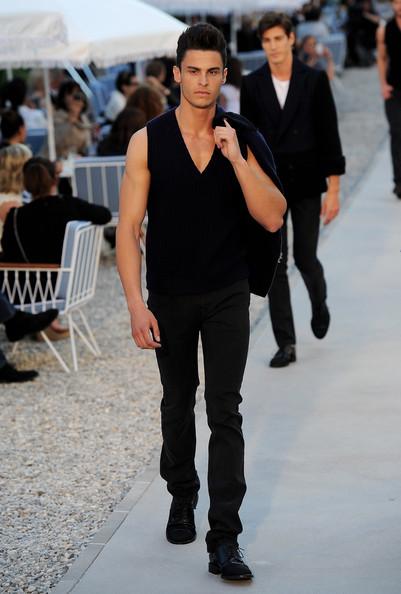 Baptiste Giabiconi walks the runway during the Chanel Collection Croisiere Show 2011-12 at the Hotel du Cap on May 9, 2011 in Cap d'Antibes, France.