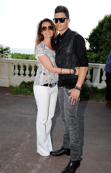 Baptiste Giabiconi (R) and Mademoiselle Agnes attend the Chanel Collection Croisiere Show 2011-12 at the Hotel du Cap on May 9, 2011 in Cap d'Antibes, France.