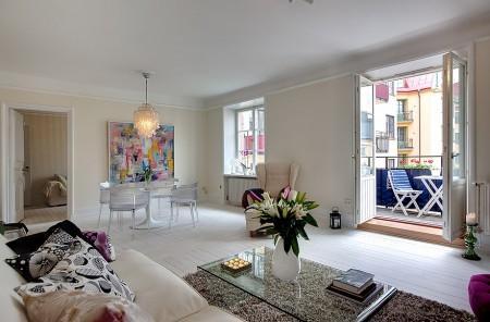 suelo de madera muy oscuro suelo de madera blanco sofa fucsia piso de alquiler en suecia inmobiliarias suecas estilo nórdico diseño nórdico diseño escandinavo cuarto de baño moderno cocinas modernas cocinas blancas chandelier de coral 