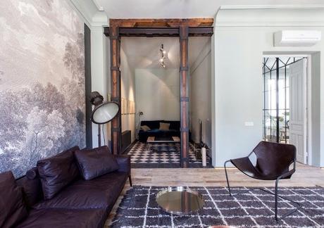 decoralinks | salon estilo masculino con mural en blanco y negro y vigas de madera y hierro