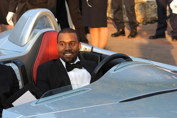 Kanye West arriving at the glamorous Hotel Du Cap in a sporty Mercedes for the amfAR 2011 Fight Against Aids party.