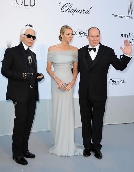 Karl Lagerfeld, Charlene Wittstock and Prince Albert II of Monaco attend amfAR's Cinema Against AIDS Gala during the 64th Annual Cannes Film Festival at Hotel Du Cap on May 19, 2011 in Antibes, France.