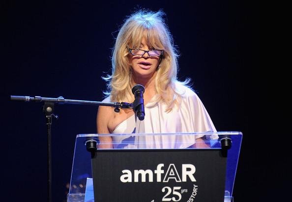 Goldie Hawn speaks onstage at amfAR's Cinema Against AIDS Gala during the 64th Annual Cannes Film Festival at Hotel Du Cap on May 19, 2011 in Antibes, France.