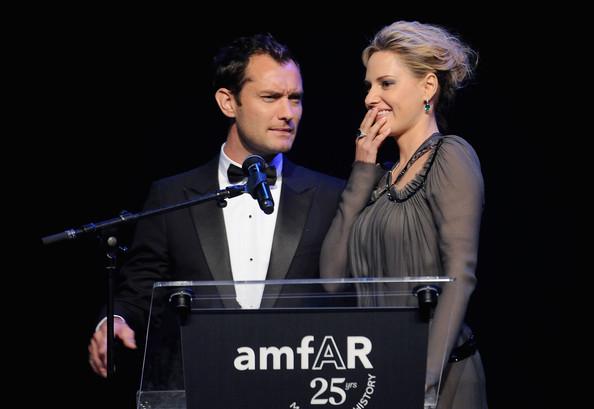 Jude Law appears onstage with Aimee Mullins at amfAR's Cinema Against AIDS Gala during the 64th Annual Cannes Film Festival at Hotel Du Cap on May 19, 2011 in Antibes, France.