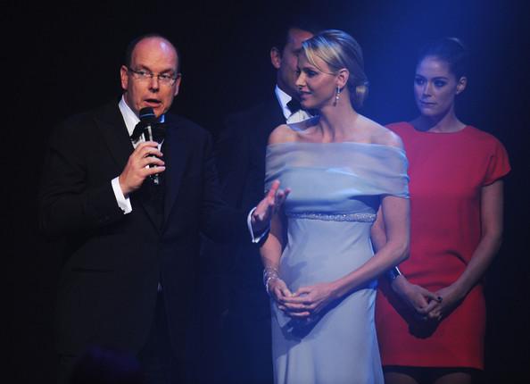 Prince Albert II of Monaco and Charlene Wittstock onstage at amfAR's Cinema Against AIDS Gala during the 64th Annual Cannes Film Festival at Hotel Du Cap on May 19, 2011 in Antibes, France.