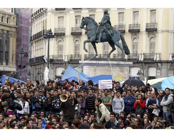 Demonstrators listen to speakers in Madrid's Puerta del Sol