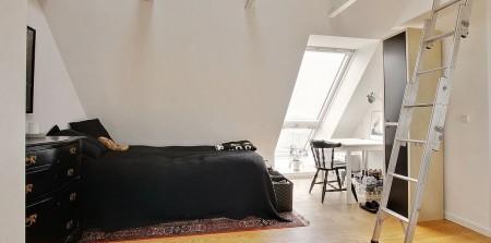 muebles de diseño mecedora eames blanca estilo nórdico diseño de interiores diseño danés decoración en blanco decoración de interiores cocina salón diáfano cocina moderna cocina blanca ático estilo nórdico ático estilo escandinavo 