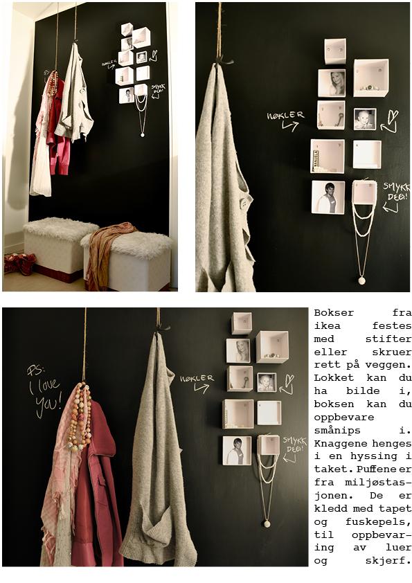 Un recibidor con la pared negra y los detalles en blanco