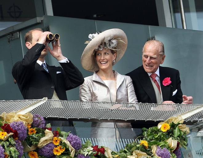 Members Of Britain's Royal Family Sophie, Duchess Of Wessex (C) And Prince Phillip (R) Look Toward Prince Edward (L) On