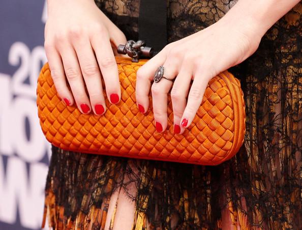 Actress Emma Stone (clutch detail) arrives at the 2011 MTV Movie Awards at Universal Studios' Gibson Amphitheatre on June 5, 2011 in Universal City, California.