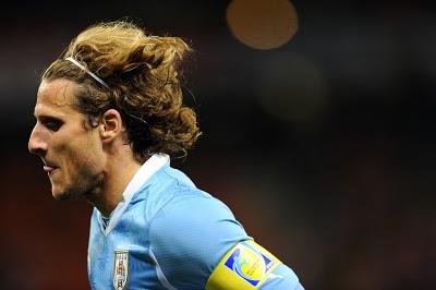 Los rizos de Forlán