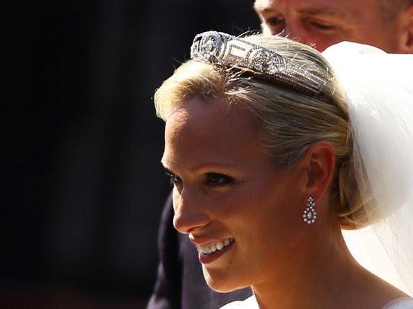 Zara Phillips departs afterher Royal wedding to Mike Tindall at Canongate Kirk on July 30, 2011 in Edinburgh, Scotland. The Queen's granddaughter Zara Phillips will marry England rugby player Mike Tindall today at Canongate Kirk. Many royals are expected to attend including the Duke and Duchess of Cambridge.