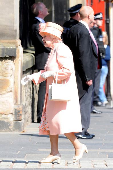 Queen Elizabeth II and Prince Phillip, the Duke of Edinburgh, arrive at Edinburgh's historic Canongate Kirk for the wedding of their granddaughter Zara Phillips and Mike Tindall.