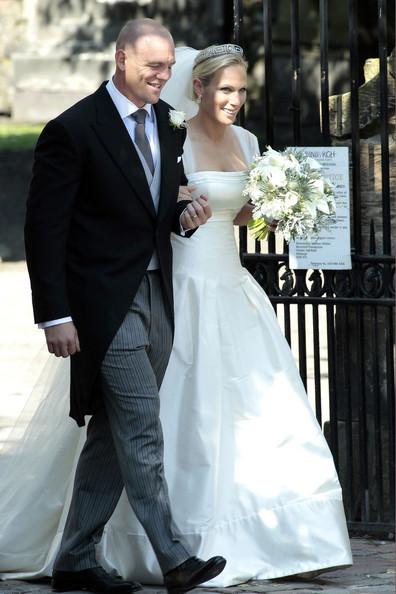 Zara Phillips and Mike Tindall leave the Canongate Kirk on Edinburgh's historic Royal Mile following their royal wedding.