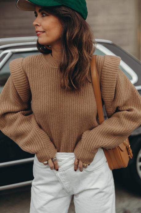 Sara from Collage Vintage wearing a camel Isabel Marant cashmere pullover and white Agolde jeans