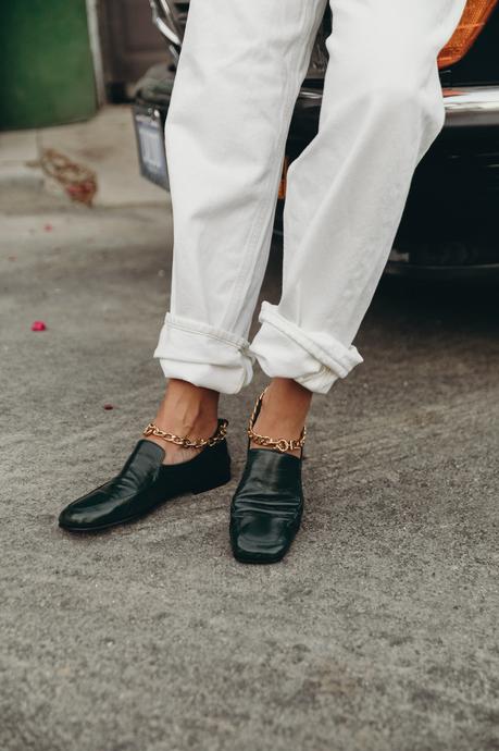 Sara from Collage Vintage wearing a camel Isabel Marant cashmere pullover and white Agolde jeans