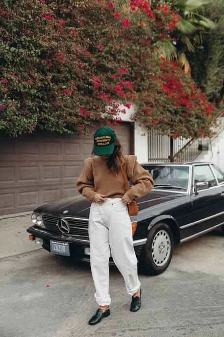 Sara from Collage Vintage wearing a camel Isabel Marant cashmere pullover and white Agolde jeans