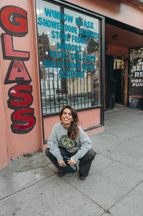 Sunday at antiques stores wearing a Simon Miller Sweatshirt and mini Puffin bag