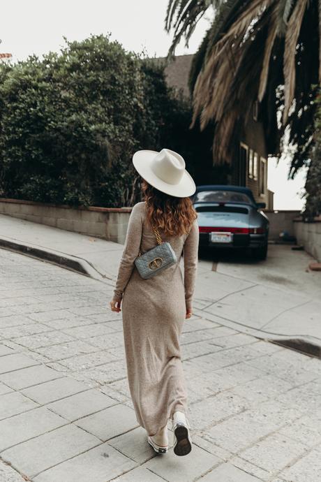 Sara from Collage Vintage wearing a midi knit dress, all star sneakers and cloud blue Caro Dior bag