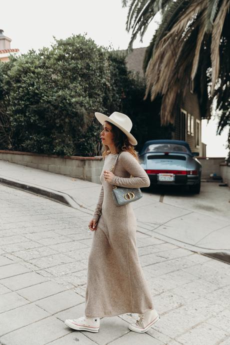 Sara from Collage Vintage wearing a midi knit dress, all star sneakers and cloud blue Caro Dior bag