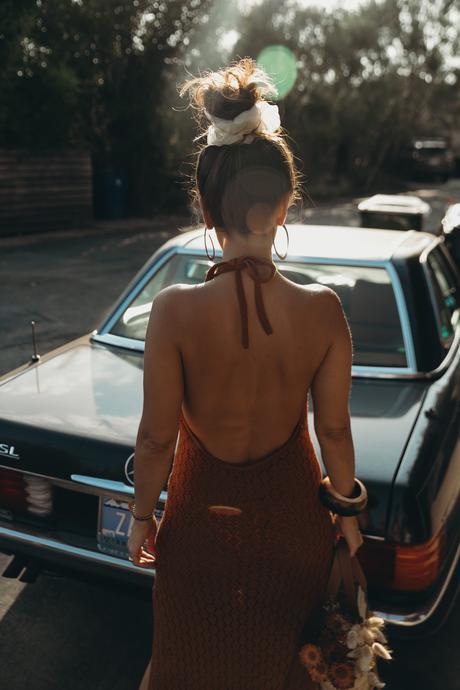 Sara from Collage Vintage wearing a Cult Gaia crochet dress and a Loewe basket